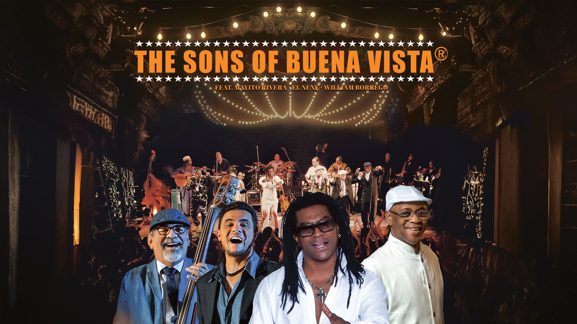 Bandfoto von The Sons of Buena Vista vor einer Konzertbühne mit mehreren Musikern und beleuchtetem Hintergrund.