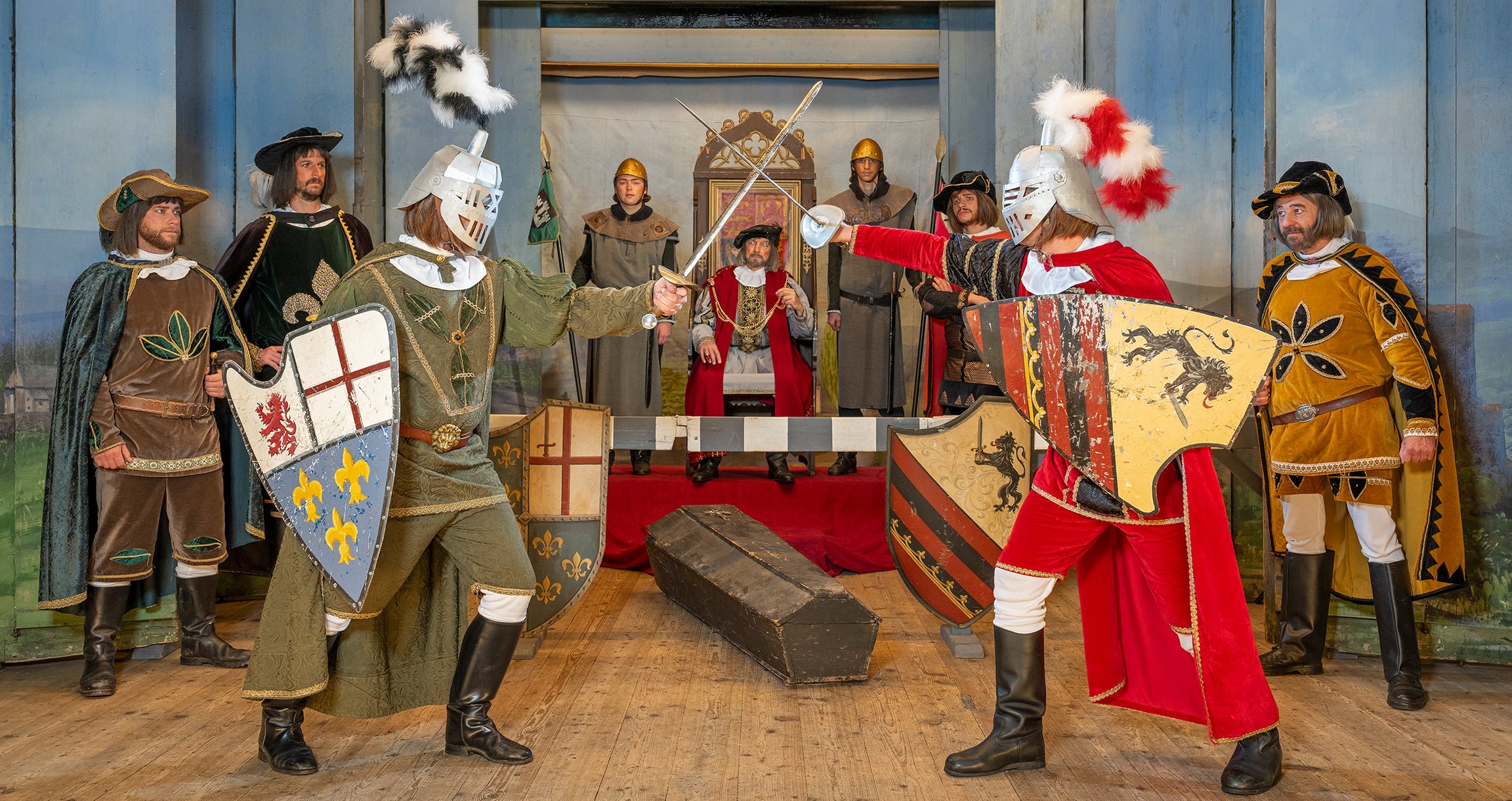 eine Darstellung des Theaters mit einem Kampf von Rittern vor dem König
