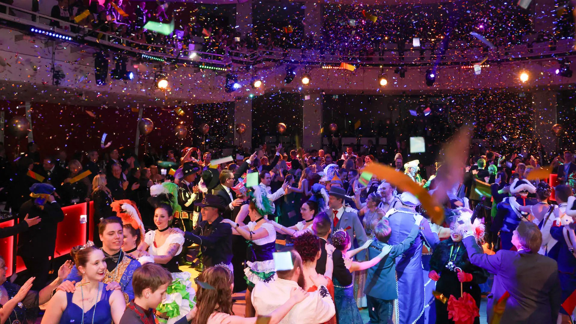 Ein Foto für das Event Narrhalla Ball 2026, mit tanzenden Menschen und Konfetti.