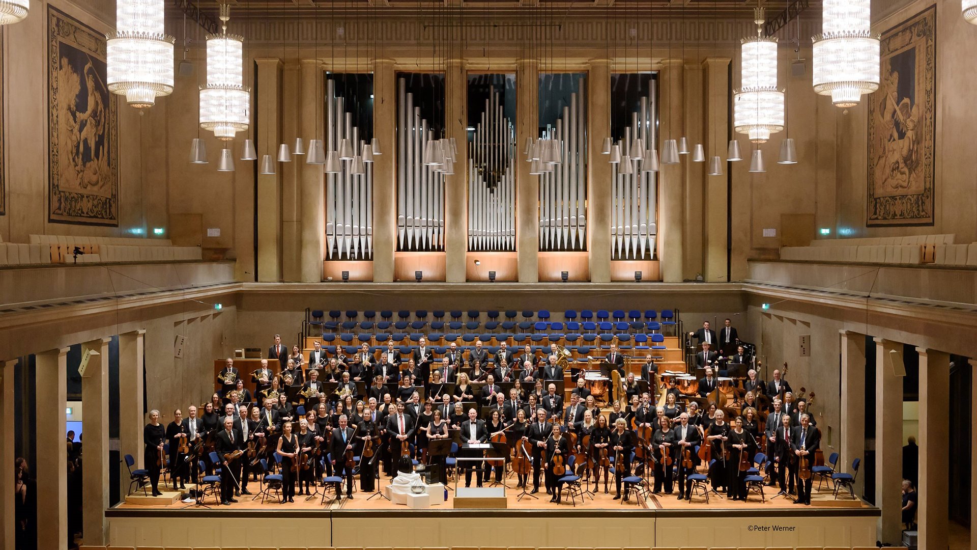 Foto für die Veranstaltung „Patentorchester München – Der Tonraum – unendliche Weiten“ mit dem Orchester.