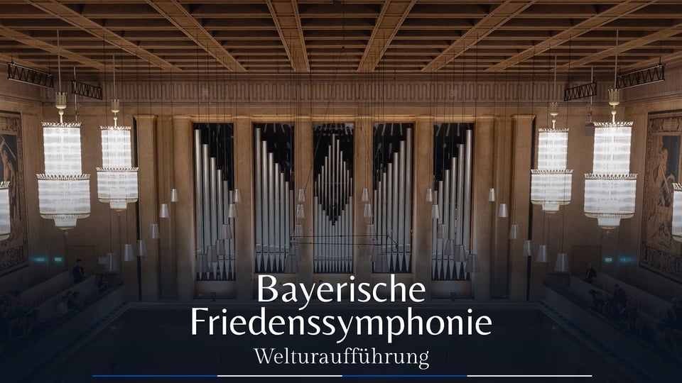 Foto für das Event Sound of Peace mit einem Innenraumfoto eines eleganten Gebäudes, in dem stilvolle, herabhängende Lampen zu sehen sind.