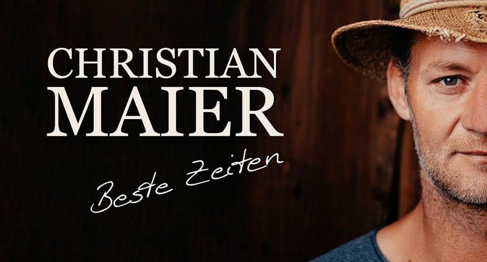 das Plakat der Veranstaltung mit weißen Buchstaben auf schwarzem Hintergrund und rechts das Gesicht eines Mannes mit Hut.