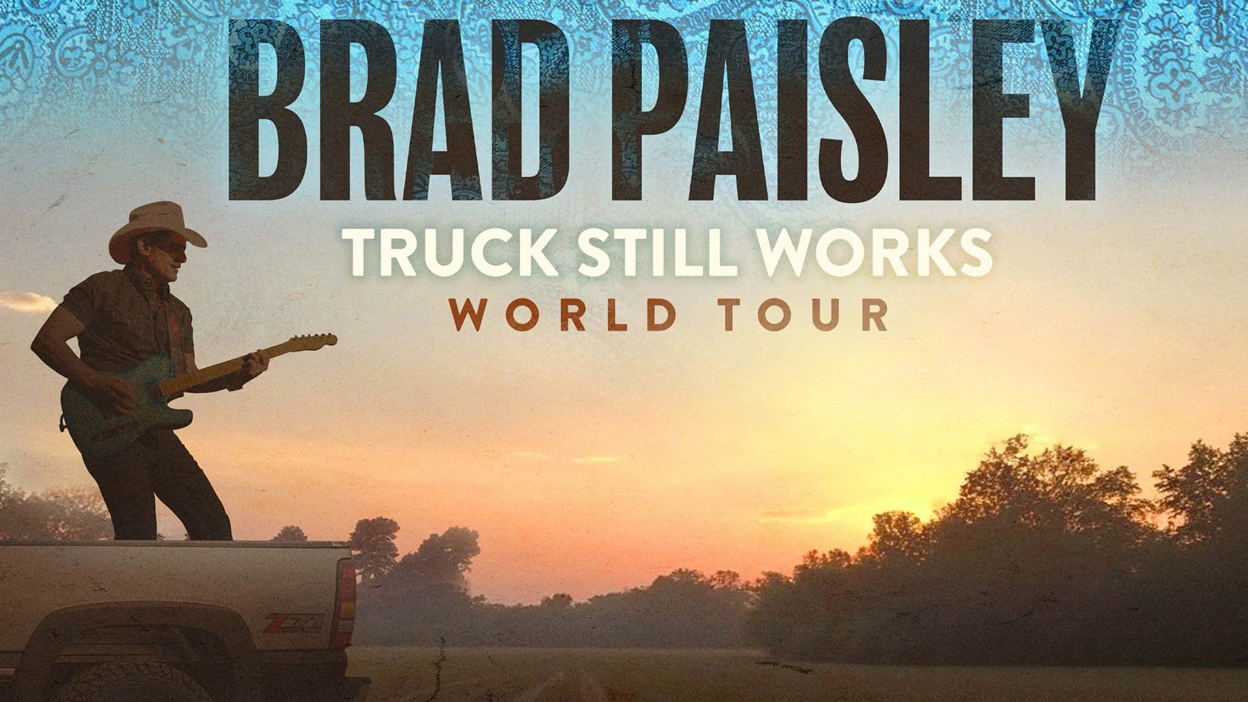 Brad Paisley sitzt mit Gitarre auf einem Truck – Eventplakat zur „Truck Still Works World Tour“ mit großem Schriftzug seines Namens.