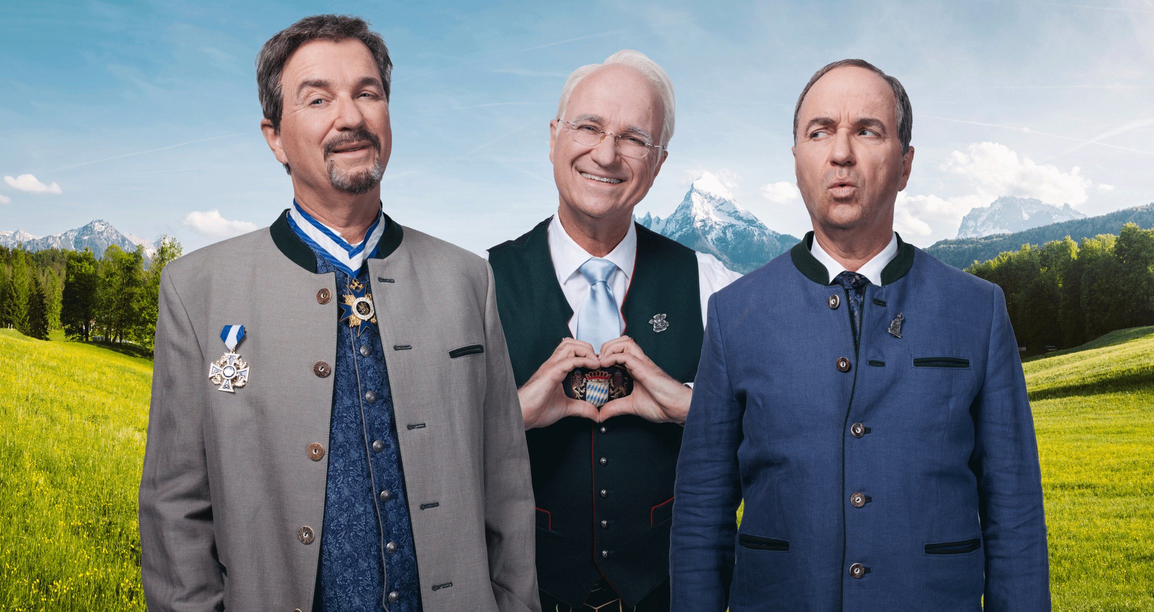 3 Männer vor Alpen Hintergrund